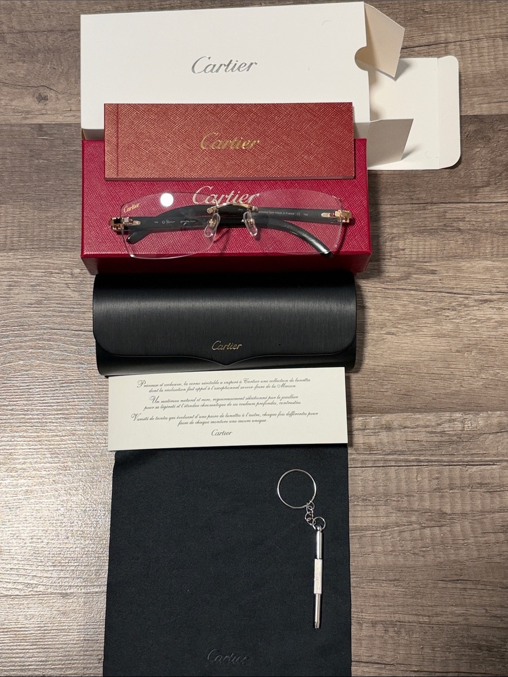 Cartier buffs sunglasses w gold rimless frames and clear lenses comes with tools